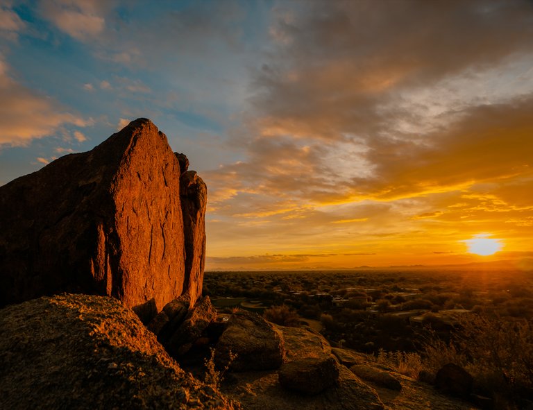 Beautiful desert sunset red rock boulder looking over Arizona desert, Scottsdale and Phoenix. - pictures: beautiful desert
