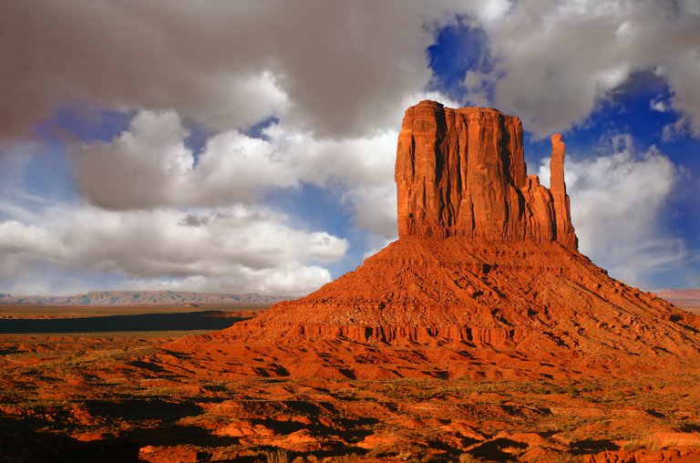 Butte at Sunset in Monument Valley Utah With Cloudy Sky